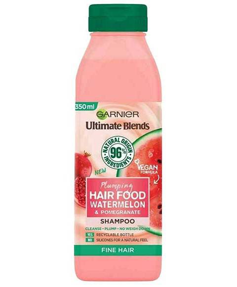 Garnier Ultimate Blends Plumping Watermelon Shampoo bottle with vibrant design and watermelon graphics on a white background.