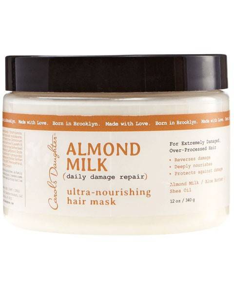 Carols Daughter Almond Milk Ultra Nourishing Hair Treatment mask in a jar, designed to hydrate and nourish dry hair.