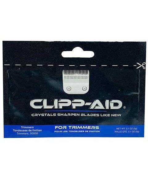 Clipp Aid salon accessory crystals sharpening trimmer blades, showing crystals and trimmer blade in close-up.