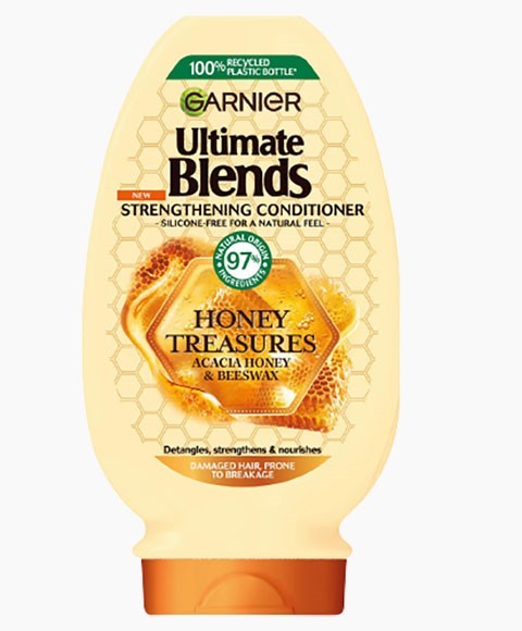 Garnier Ultimate Blends Honey Treasures strengthening conditioner bottle with honey and natural ingredients for hair care