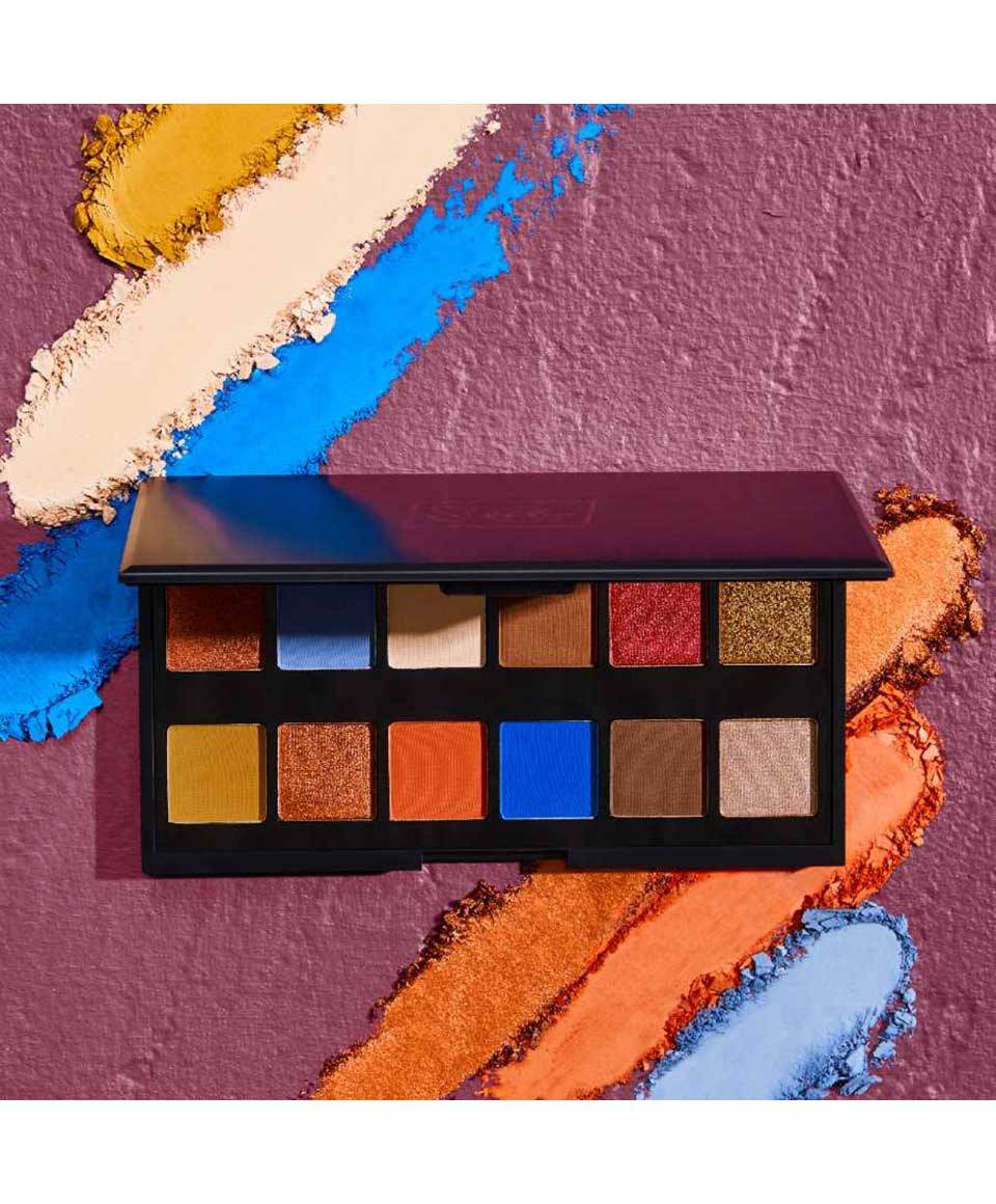 Sleek Make Up Eyeshadow Palette Trippin with vibrant and neutral eye makeup shades displayed in an open palette.