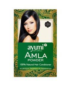 Ayumi Naturals Amla Powder hair treatment in a bowl, showcasing vibrant green powder for nourishing hair care.
