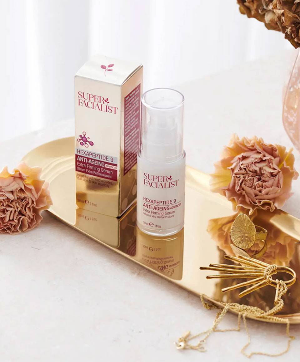 Super Facialist Hexapeptide 9 Anti-Ageing Extra Firming Serum moisturizer bottle on a clean surface.