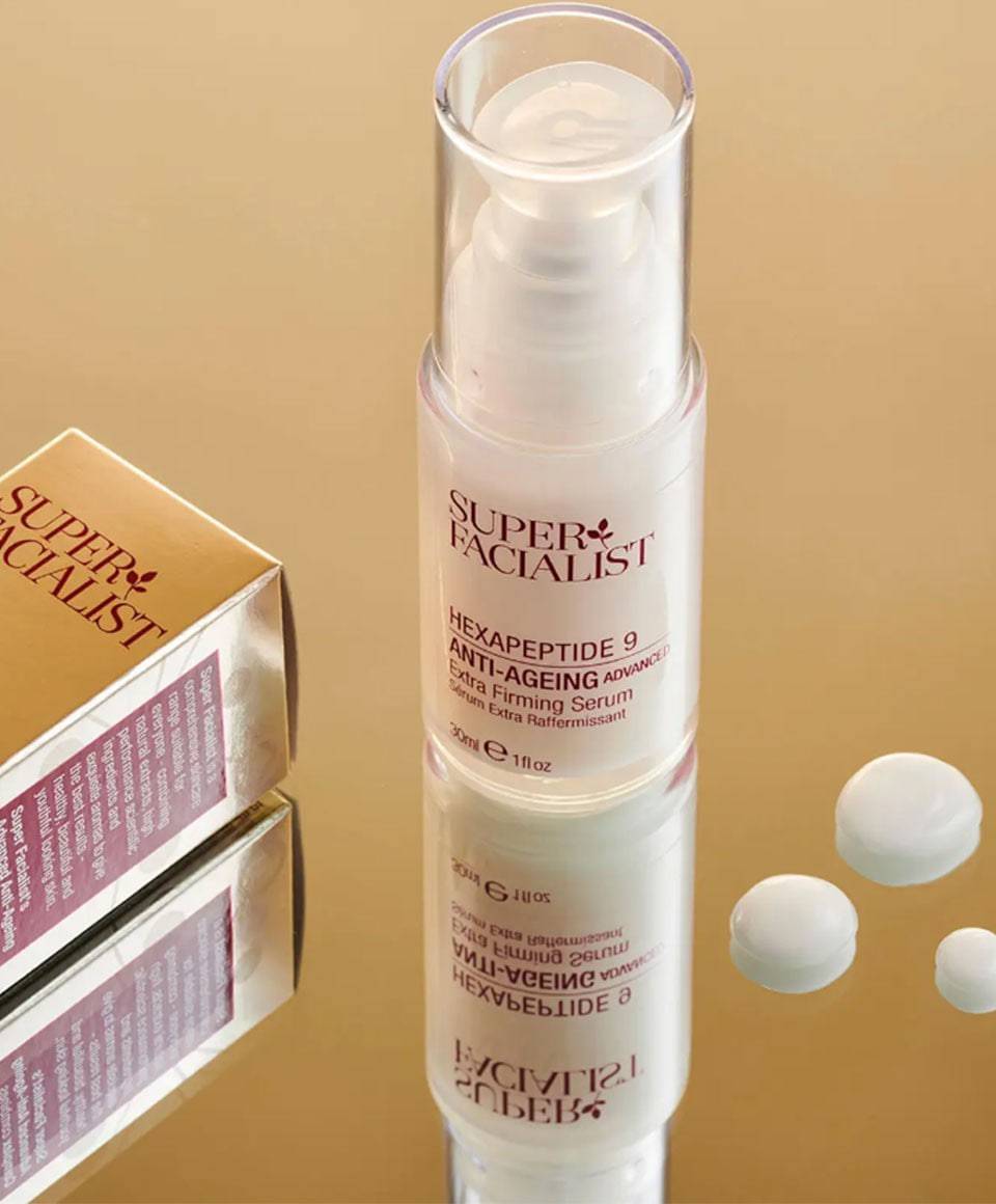 Super Facialist Hexapeptide 9 Anti-Ageing Extra Firming Serum moisturizer in a sleek bottle with a pump dispenser.