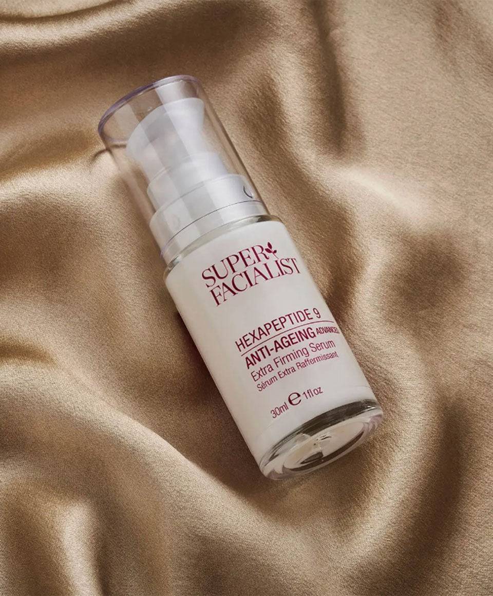 Super Facialist Hexapeptide 9 Anti-Ageing Extra Firming Serum in a moisturizer bottle, highlighting skincare for aging skin.