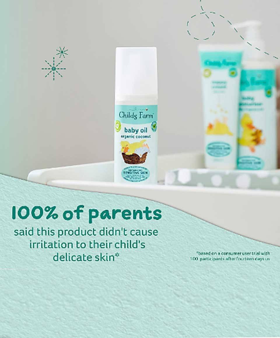 Childs Farm Baby Oil with organic coconut, soothing skin for babies, clear bottle showing the product in a natural setting