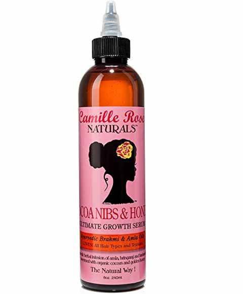 Camille Rose Naturals Cocoa Nibs and Honey Hair Serum and Oil bottle with ingredients visible on the label.