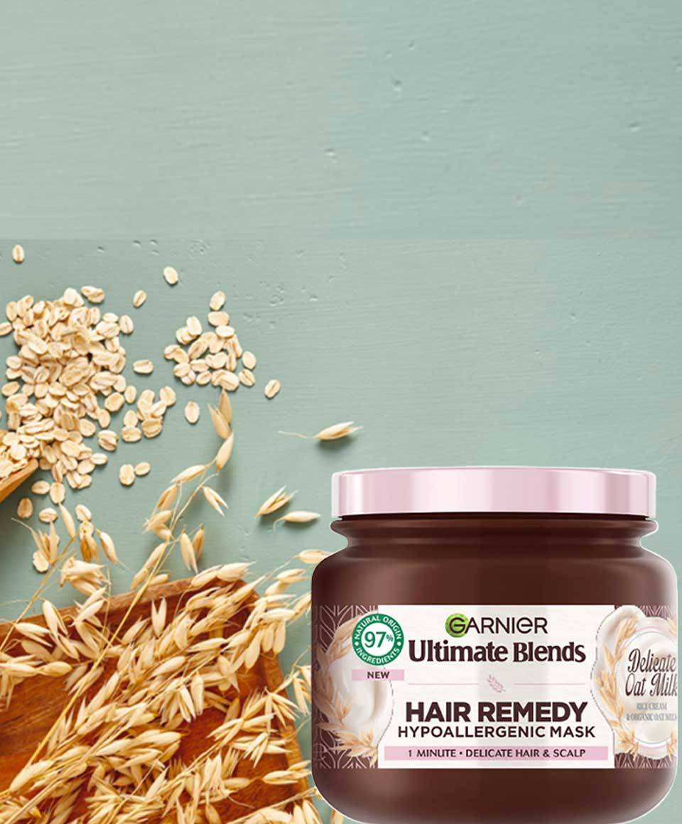Garnier Ultimate Blends Delicate Oat Milk Hair Remedy Mask in a jar, creamy hair treatment for nourishing and smoothing hair.