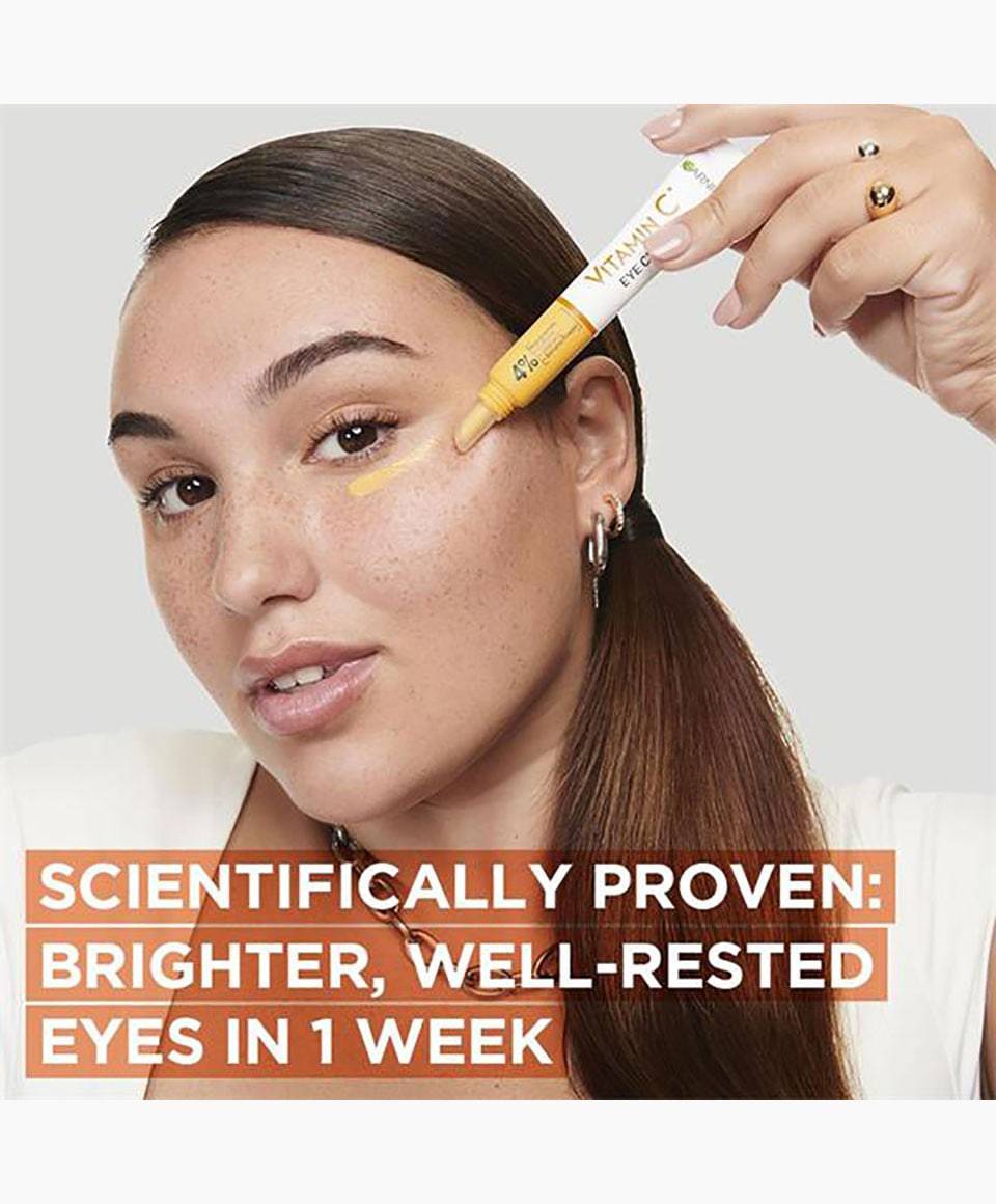Garnier Skin Active Vitamin C Brightening Eye Cream in a tube for eye care, with fresh, brightening formula visible on the packaging.