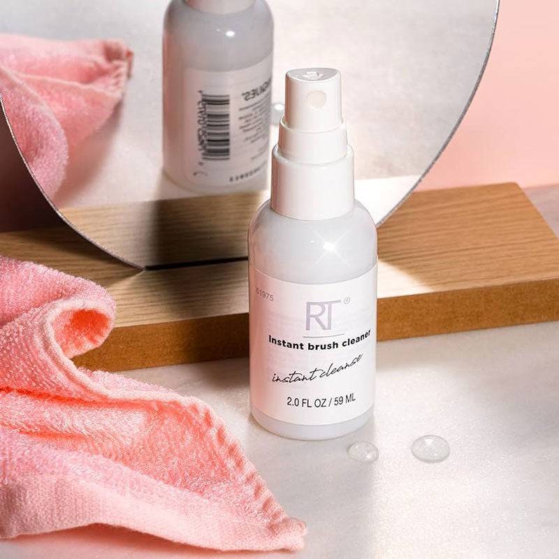 Real Techniques Instant Brush Cleaner bottle with spray nozzle, salon accessories for quick makeup brush cleaning.