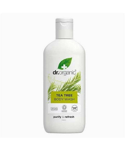 Dr Organic Bioactive Skincare Organic Tea Tree Body Wash in a clear bottle with a green label and tea tree leaves.