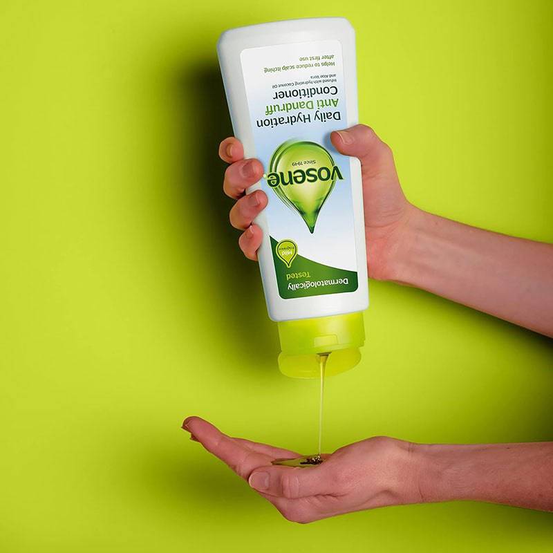 Vosene Daily Hydration anti-dandruff conditioner bottle with label, shown in a natural setting on a white background.