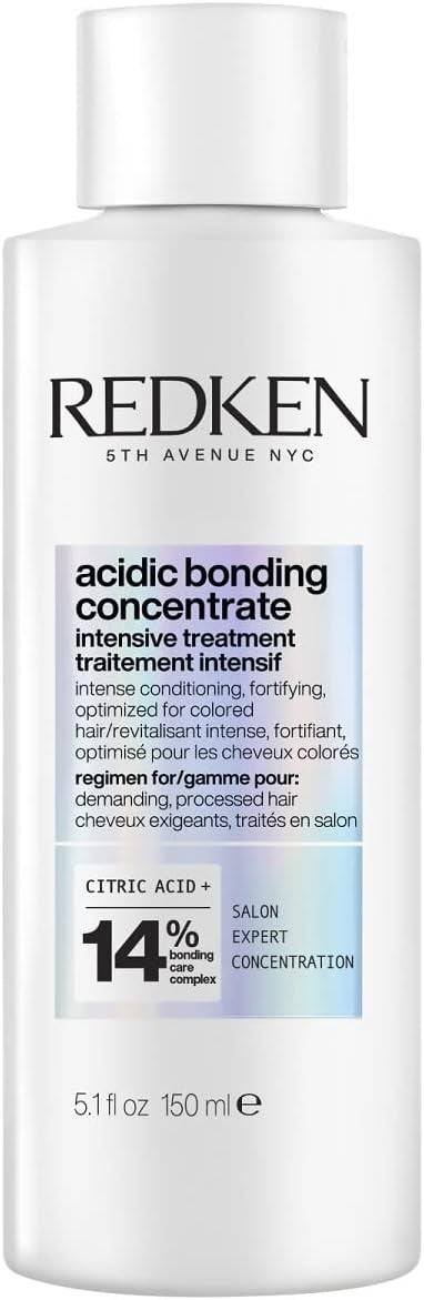Redken Acidic Bonding Concentrate intensive hair treatment in a jar, designed to strengthen and repair damaged hair strands.