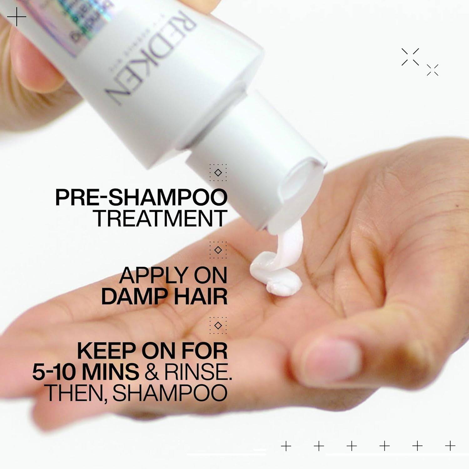 Redken Acidic Bonding Concentrate hair treatment bottle with pump for repairing and strengthening damaged hair.