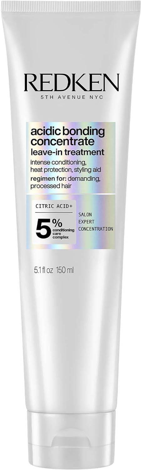 Redken Acidic Bonding Concentrate leave-in hair treatment in a bottle, designed to strengthen and repair damaged hair.