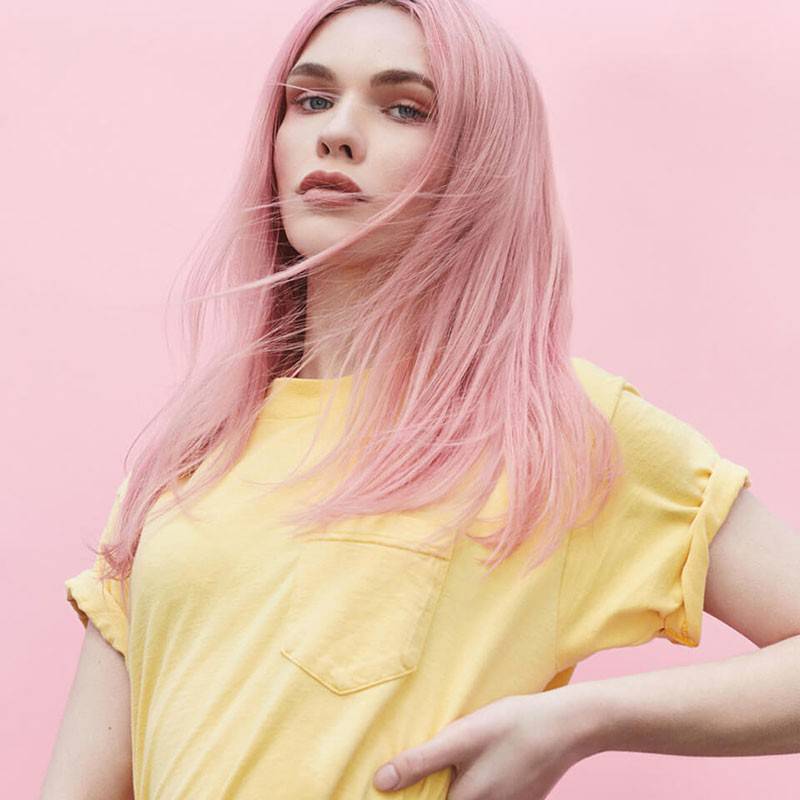 Bleach London Rose Toner applied to hair, showcasing a vibrant pink hue for hair coloring and bleaching.