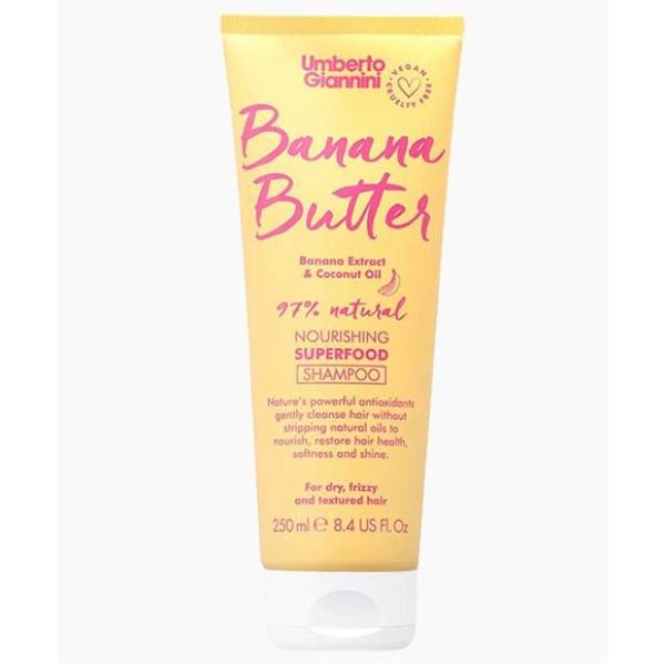 Umberto Giannini Banana Butter Coconut Oil nourishing shampoo bottle with a colorful label, designed for healthy hair care.