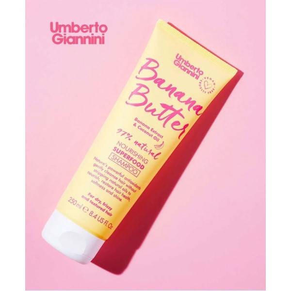 Umberto Giannini Banana Butter Coconut Oil nourishing shampoo bottle with tropical fruit and coconut imagery on the label.