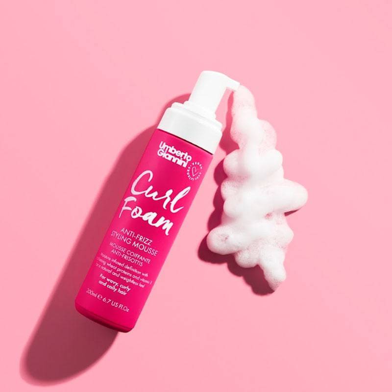 Umberto Giannini Curl Foam Anti Frizz Styling Mousse in a bottle with pump dispenser for smooth, frizz-free curls.