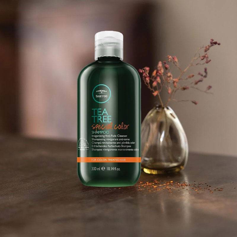 Paul Mitchell Tea Tree Special Color Shampoo bottle with label, featuring green and white packaging, on a plain background.