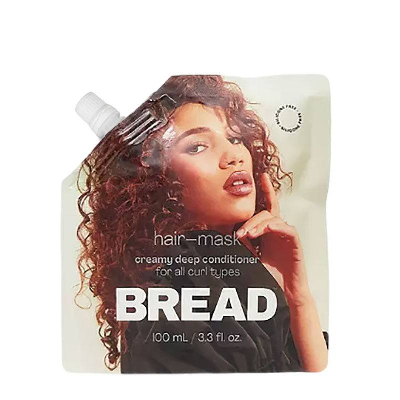 Creamy Bread Deep Conditioner Hair Mask for nourishing hair treatment, showing the rich, smooth texture in a jar.
