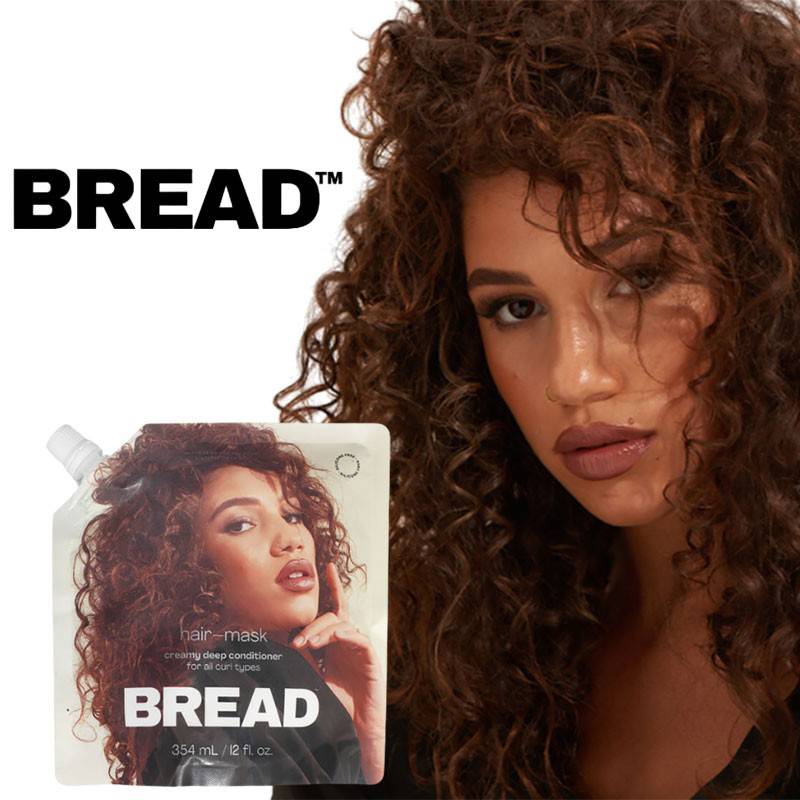 Creamy Bread Deep Conditioner hair mask for nourishing hair treatment, with a smooth, rich texture in a jar.