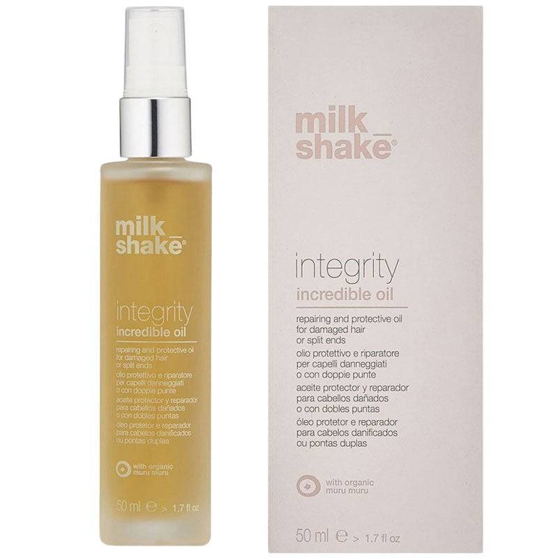 Milk Shake Integrity Incredible Oil hair treatment bottle with pump dispenser, glossy black packaging, and product label visible.
