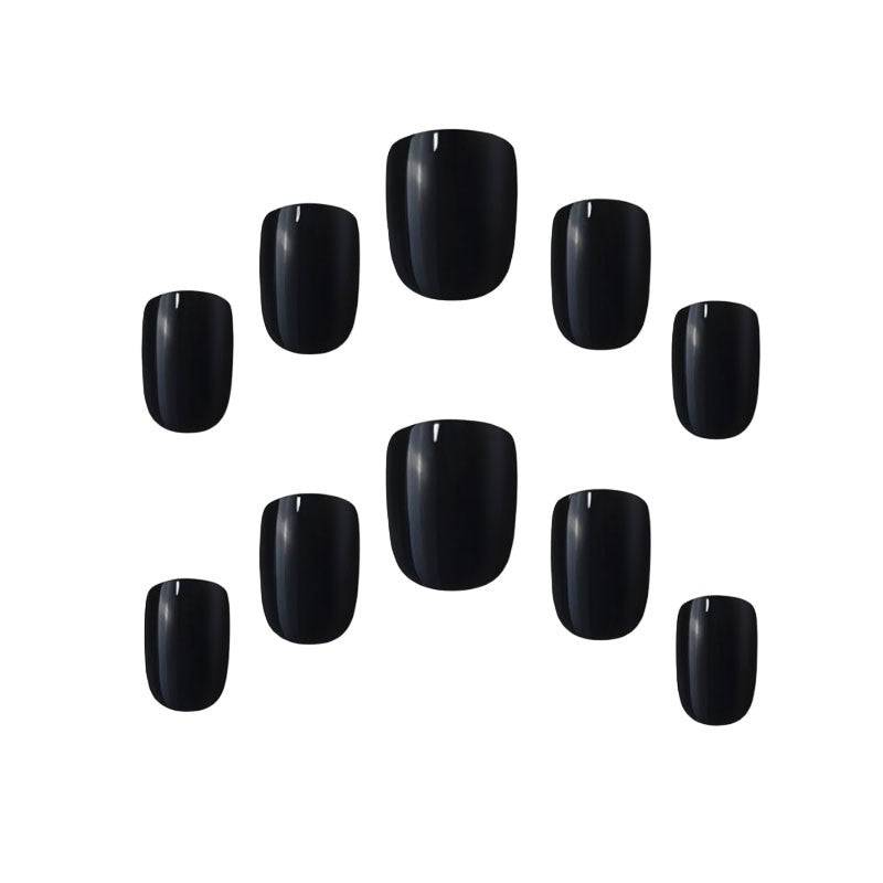 Elegant Touch black nail extension with glue, featuring a sleek, polished design for a stylish manicure.
