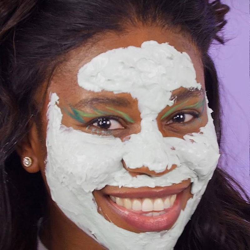 Montagne Jeunesse 7Th Heaven Dead Sea Mud Pore Perfect Mask applied on skin, showing the black clay mask for deep cleansing and pore care.