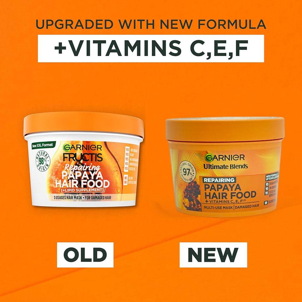 Garnier Ultimate Blends Repairing Hair Food Papaya 3 in 1 Hair Mask in a jar, showcasing its creamy texture and vibrant packaging.