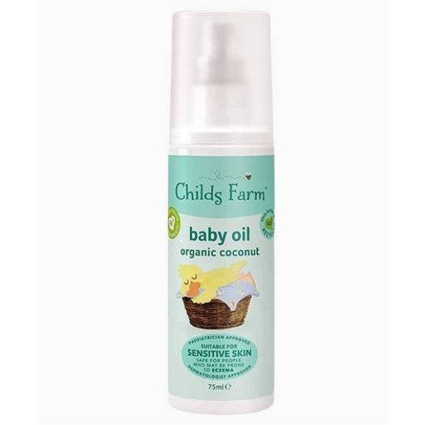 Childs Farm Baby Oil with organic coconut, skin soothing baby oil in a clear bottle with a white pump dispenser.