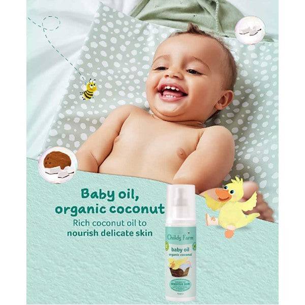 Childs Farm baby oil with organic coconut, soothing skin for babies, clear bottle showing the product and label.