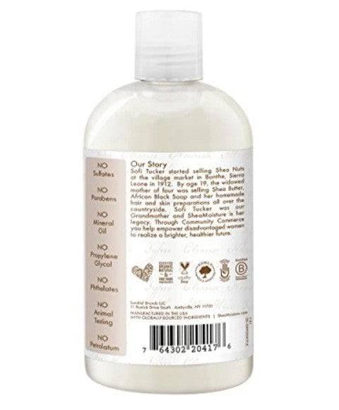 Shea Moisture 100% Virgin Coconut Oil Daily Hydration Shampoo bottle with coconut imagery and label detail.