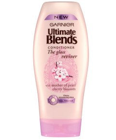 Garnier Ultimate Blends Conditioner The Gloss Reviver bottle showing the conditioner with a sleek design and vibrant label.