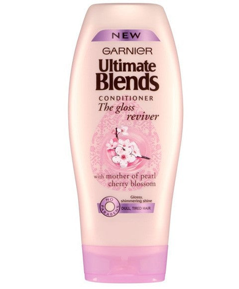 Garnier Ultimate Blends Gloss Reviver Conditioner with nourishing ingredients, showing a sleek bottle on a white background.