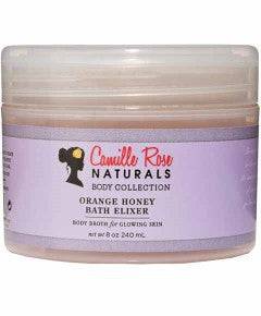 Orange Honey Bath Elixir by Camille Rose Naturals in a clear bottle, showing the bright orange liquid for bath and shower use.