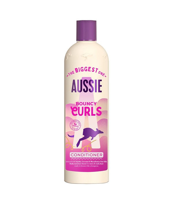 Aussie Bouncy Curls Conditioner in a 470ml bottle, smooth and hydrating formula for curly hair, with vibrant packaging.