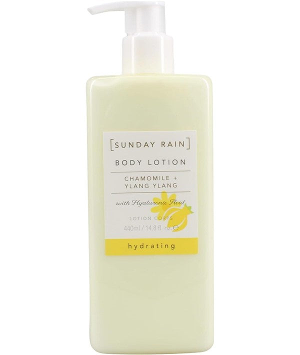 Sunday Rain chamomile and ylang ylang body lotion bottle with floral label and natural ingredients displayed.