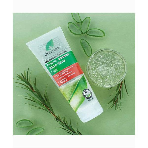 Dr Organic Bioactive Aloe Vera Gel moisturizer with tea tree and arnica, showing fresh aloe vera leaves and gel in a container