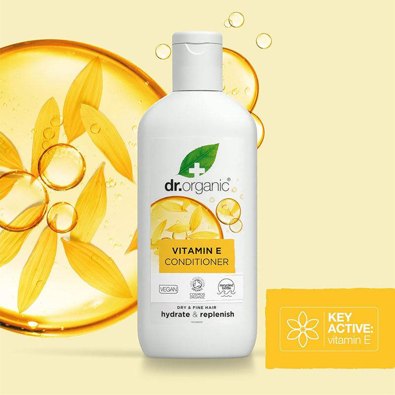 Dr Organic Hydrate and Replenish Vitamin E Conditioner bottle with pump dispenser, showing the product label and packaging.