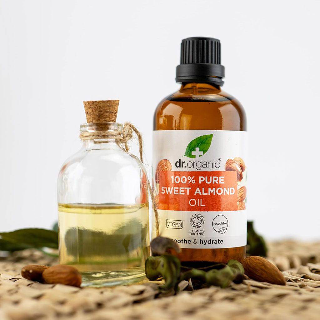 Dr Organic Soothe and Hydrate Pure Sweet Almond Oil hair treatment bottle with dropper for nourishing hair and scalp.
