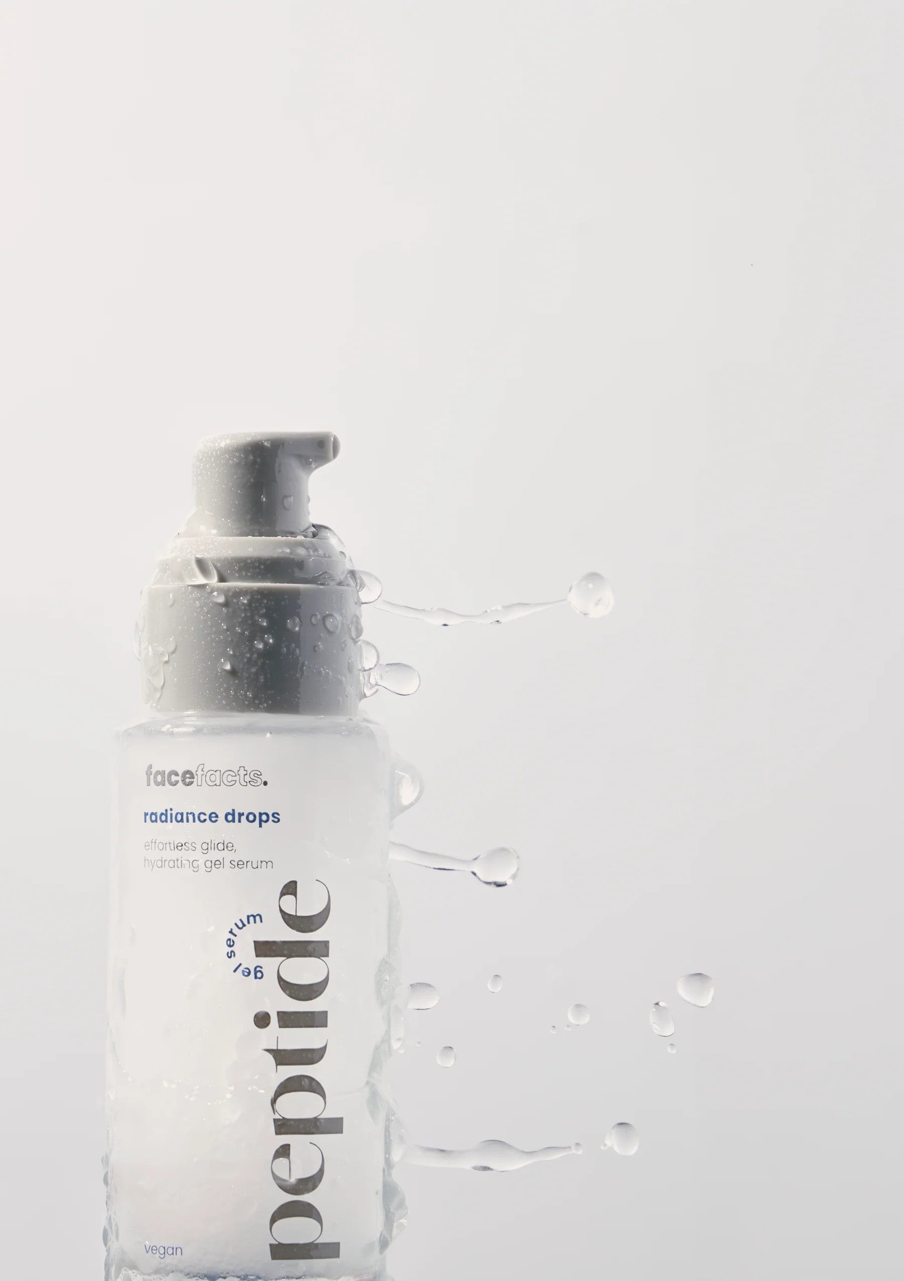 Face Facts Peptide Radiance Drops gel serum moisturizer in a clear bottle with a pump, designed to boost skin radiance.