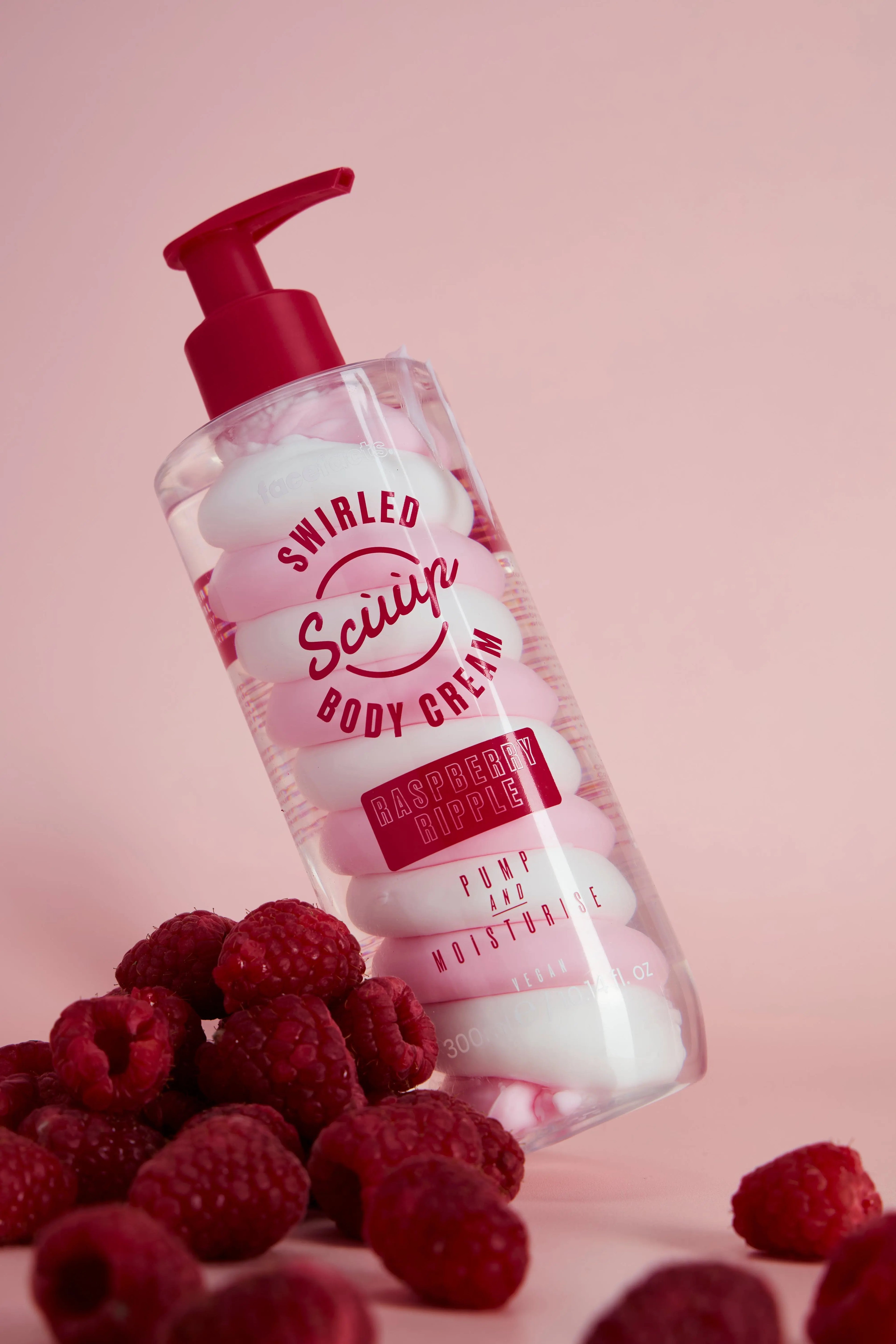 Face Facts Raspberry Ripple Swirled Body Cream jar with pink and creamy swirl design, showcasing the body care product.