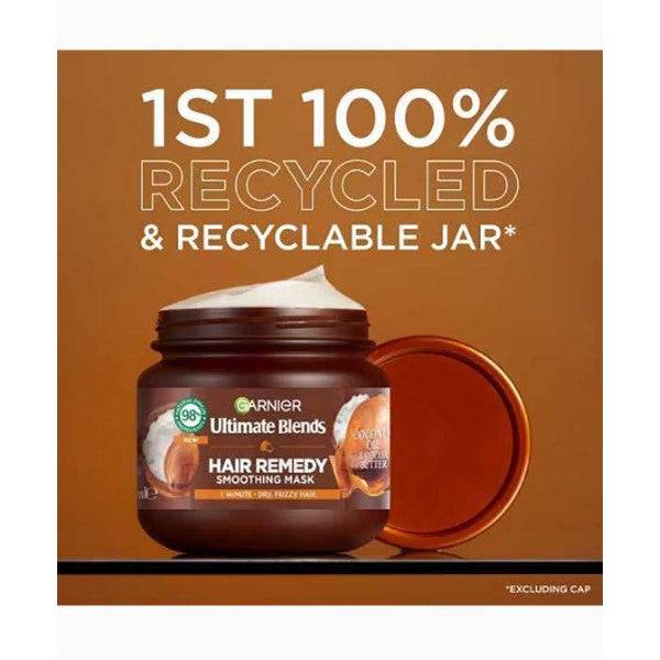 Garnier Ultimate Blends Coconut Oil and Cocoa Butter Smoothing Hair Treatment mask in a jar with coconut and cocoa butter ingredients