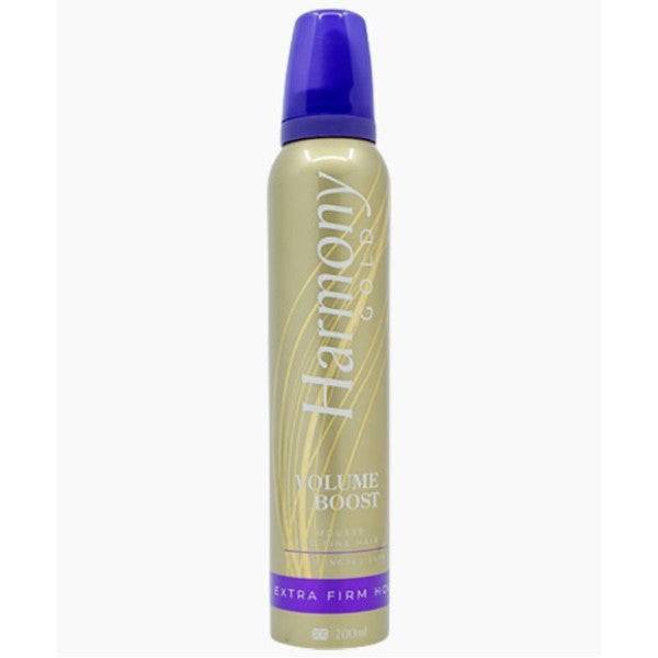 Three Pears Harmony Gold Volume Boost Mousse, a hair serum and oil, displayed in a sleek bottle with gold accents.