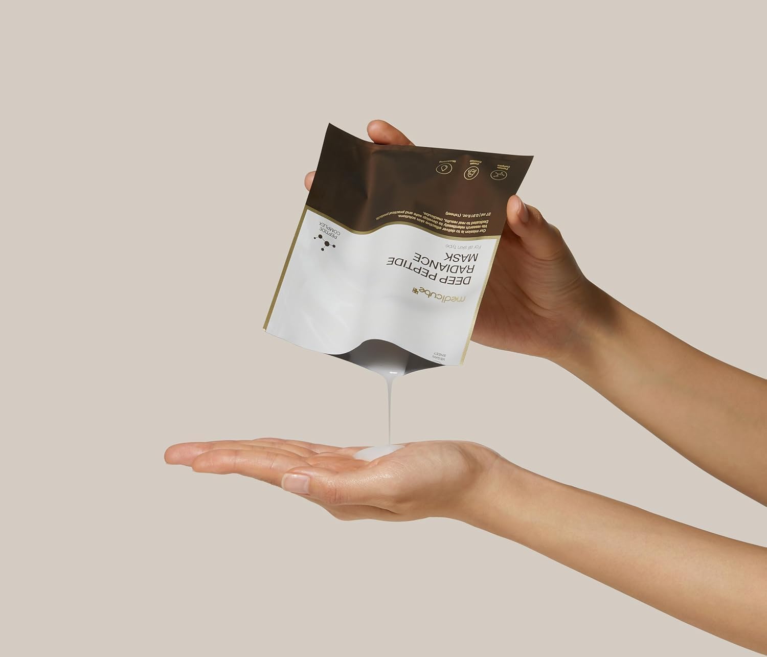 Medicube Deep Peptide Radiance Mask in a 27ml tube, showcasing its smooth texture and luxurious packaging.