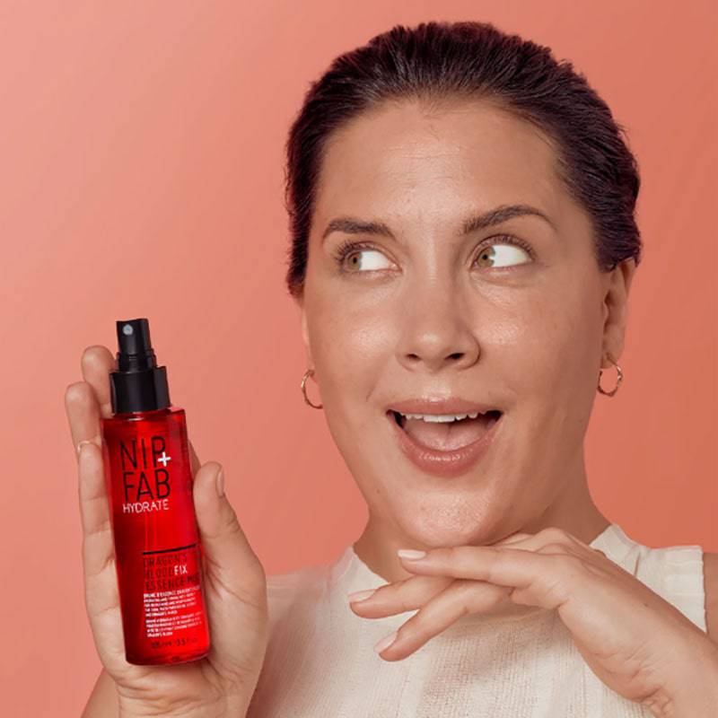 Nip Fab Hydrate Dragon Blood Fix Essence Mist bottle, skin basics product with a clear spray nozzle and vibrant packaging.