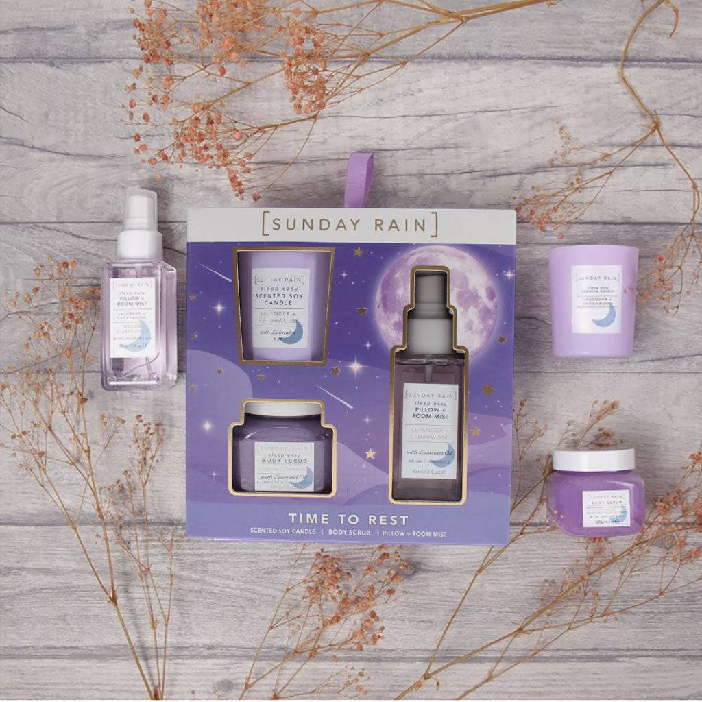 Sunday Rain Lavender and Cedarwood bath and shower trio set featuring soothing lavender and cedarwood scents in elegant bottles.