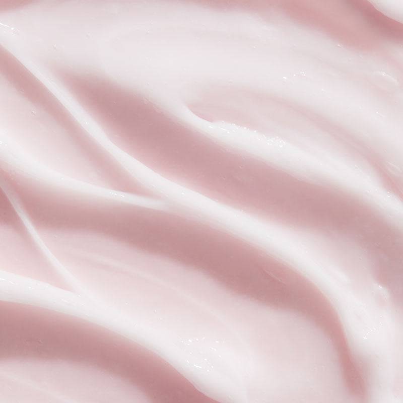 Umberto Giannini Curl Jelly hair treatment mask for curl definition and anti-frizz control, with a jar of the curl-enhancing product.