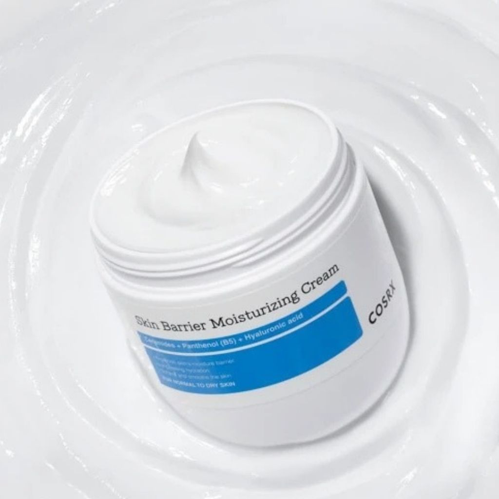 COSRX Skin Barrier Moisturizing Cream K-Beauty moisturiser in a simple product package beside its box